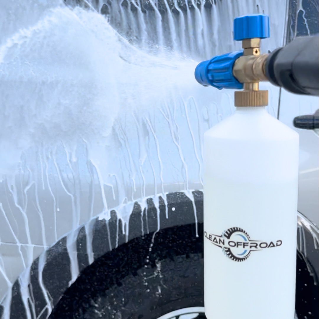 Foam Cannon applying Hydro Seal onto a wet 4WD for paint protection