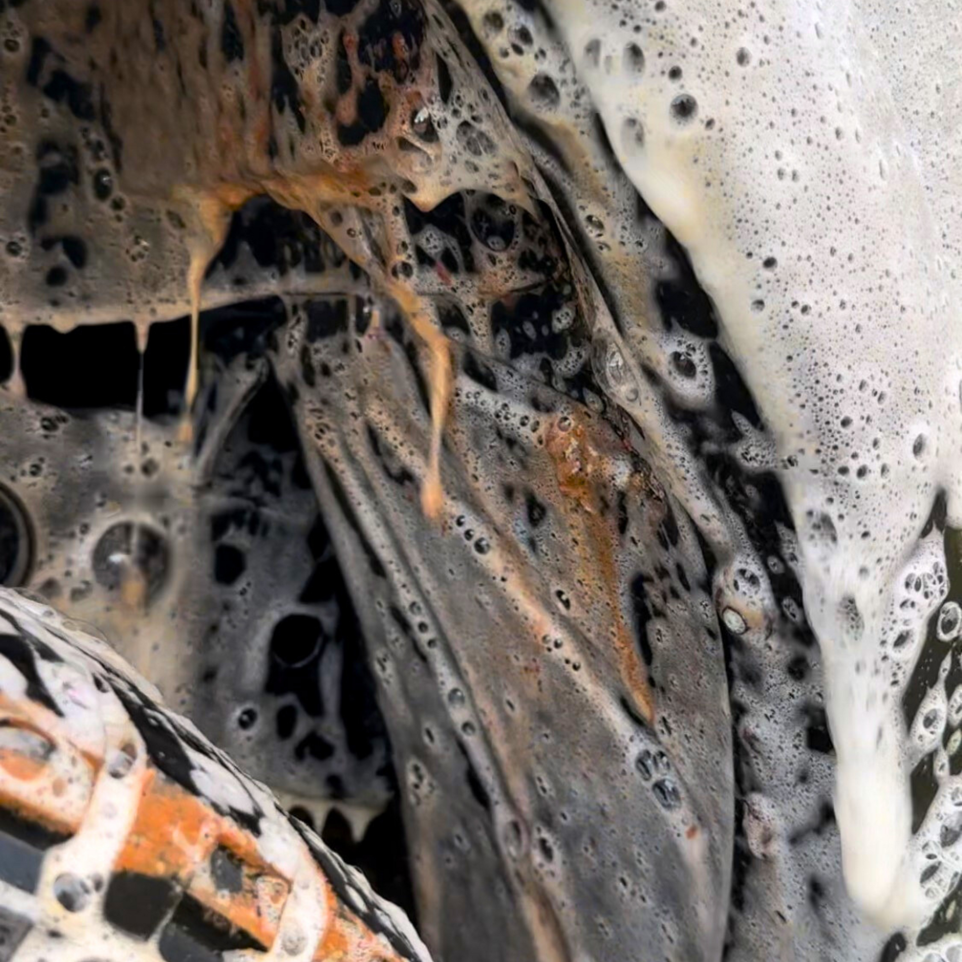 car wash removing mud and red dirt