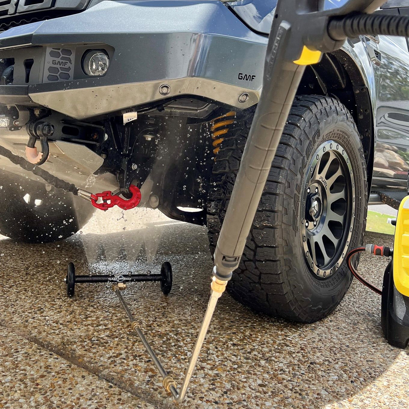 Underbody Cleaner blasting away sand, salt and mud from the underside of a 4WD